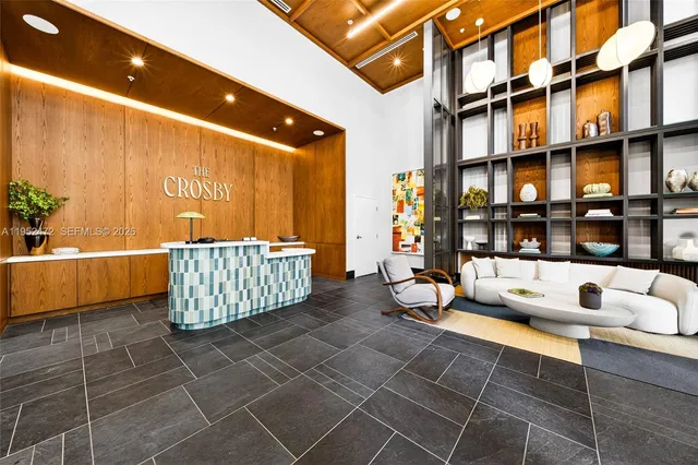 a outdoor sitting area with furniture and a chandelier