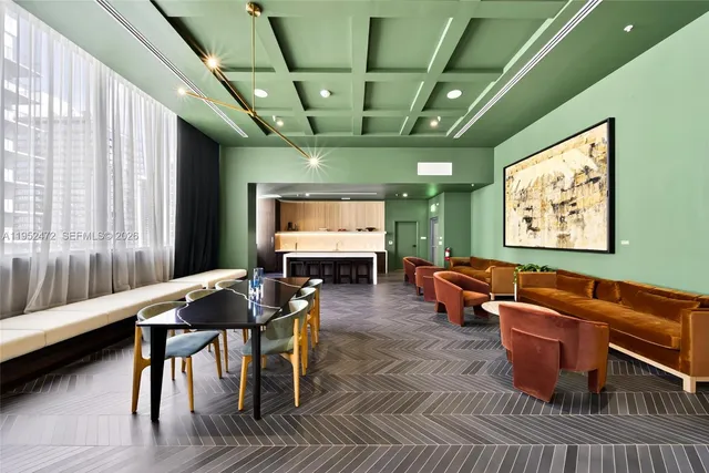 a dining room with furniture window and wooden floor