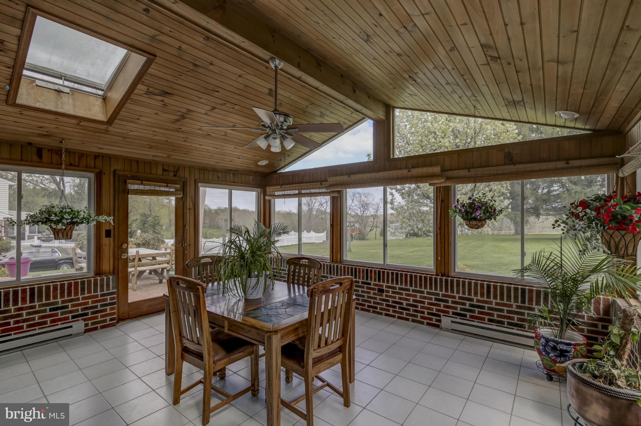 1111 Peachtree Road Fallston, MD 21047 - Photo 17 of 30 a view of a patio with table and chairs and potted plants