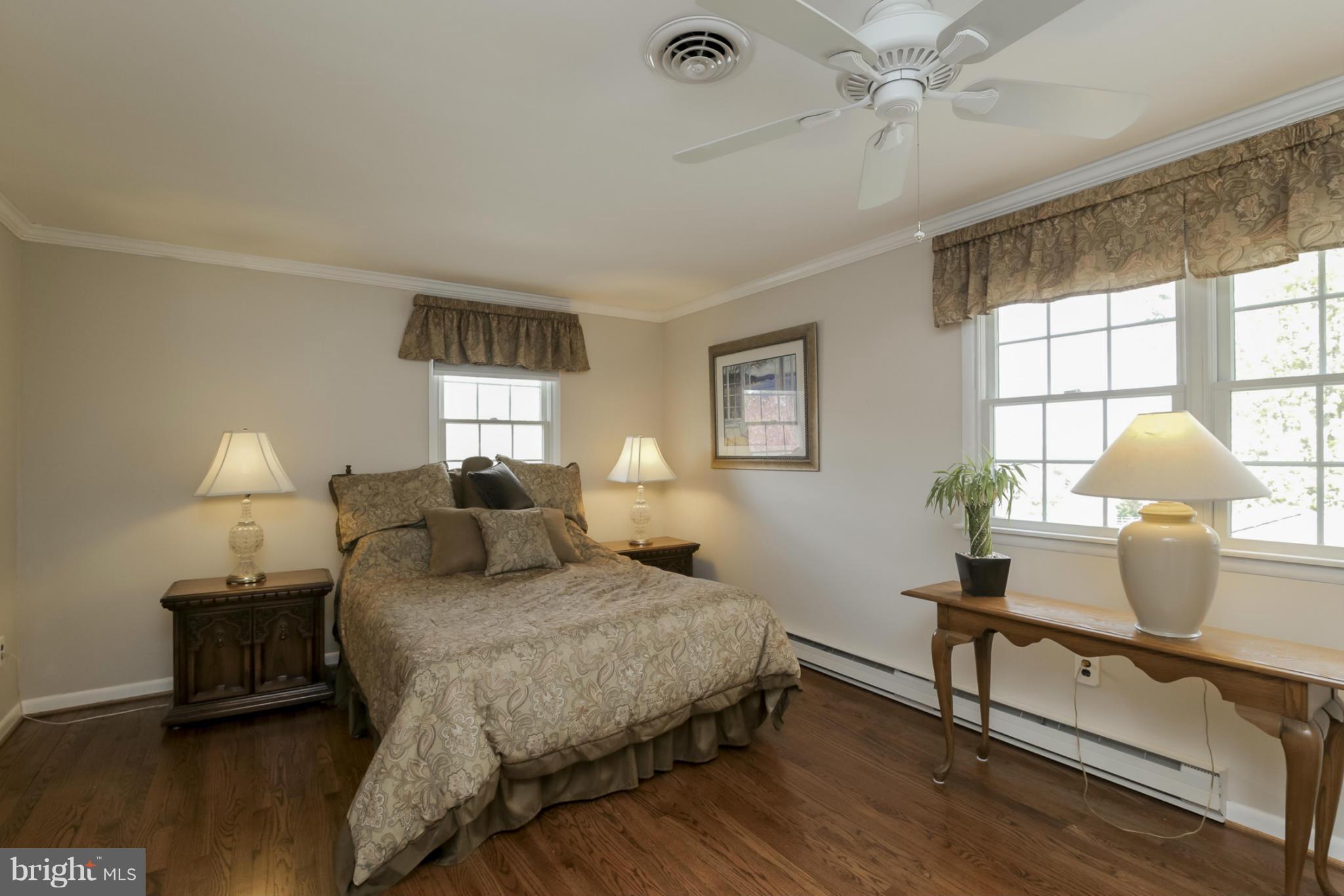 1111 Peachtree Road Fallston, MD 21047 - Photo 18 of 30 a bedroom with a bed and wooden floor