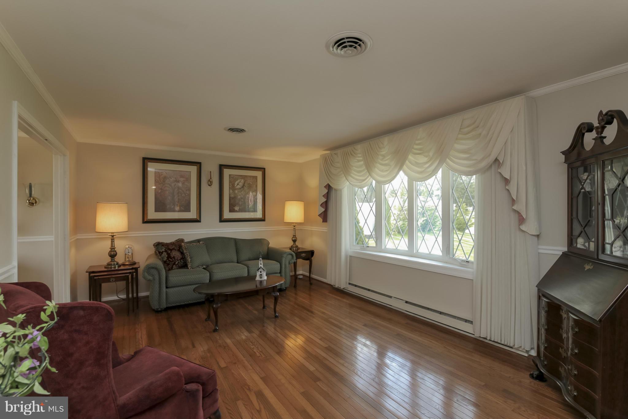 1111 Peachtree Road Fallston, MD 21047 - Photo 3 of 30 a living room with furniture a flat screen tv and a window