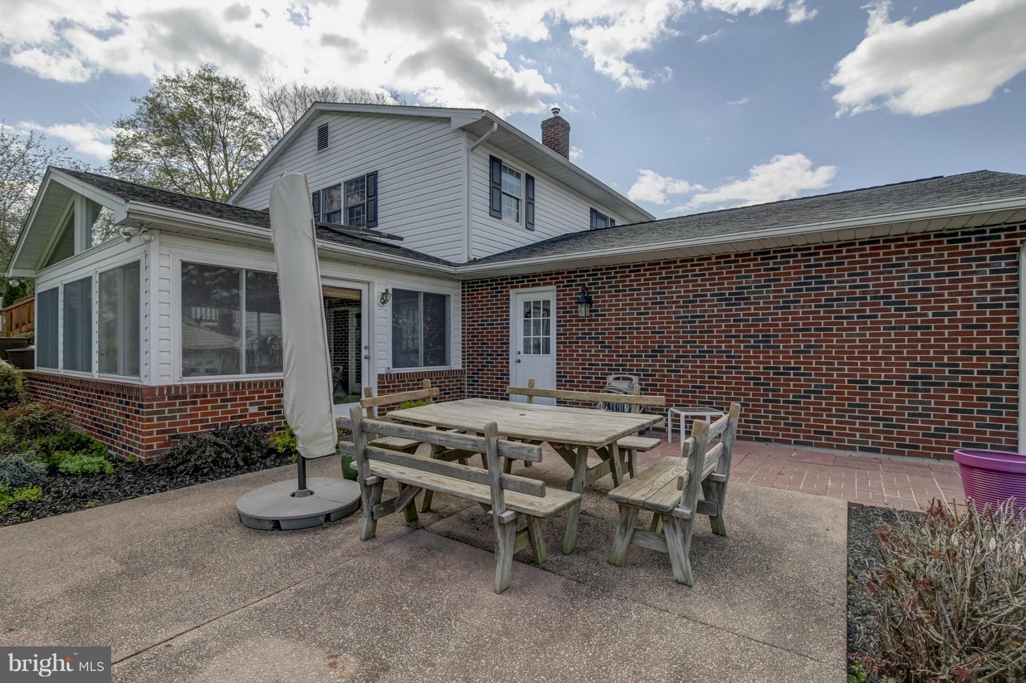 1111 Peachtree Road Fallston, MD 21047 - Photo 28 of 30 a view of a patio with table and chairs and potted plants