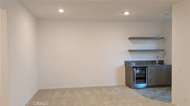 an empty room with a fireplace