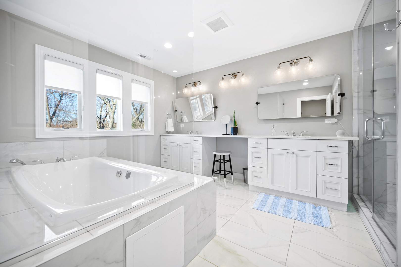 2921 Simpson Street Evanston, IL 60201 - Photo 12 of 27 a spacious bathroom with a tub sink and mirror