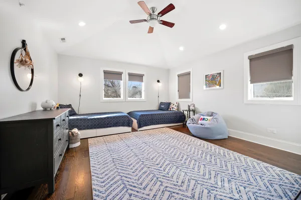a bedroom with furniture and a window