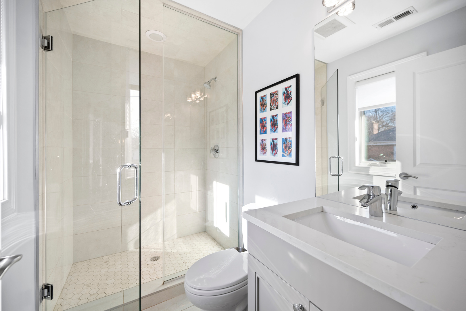 2921 Simpson Street Evanston, IL 60201 - Photo 16 of 27 a bathroom with a sink a toilet and shower