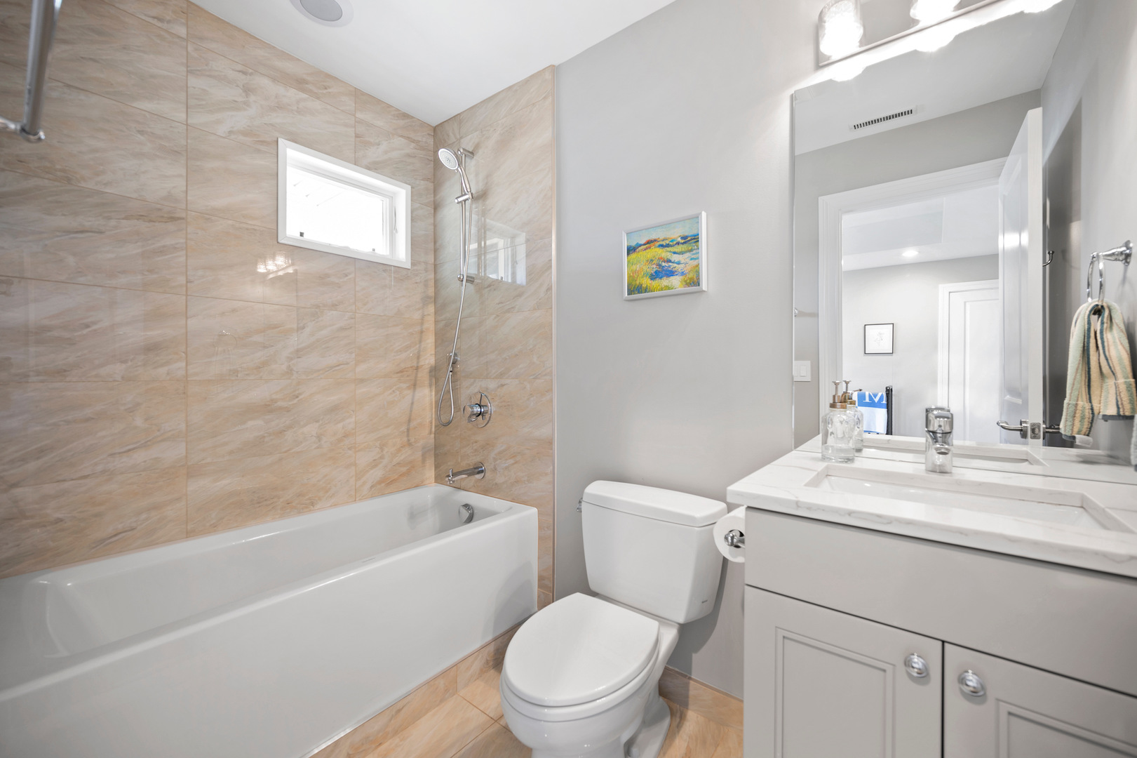 2921 Simpson Street Evanston, IL 60201 - Photo 18 of 27 a bathroom with a sink a toilet and shower