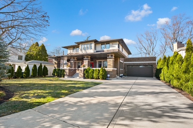 2921 Simpson Street Evanston, IL 60201 - Photo 2 of 27 a front view of a house with a yard