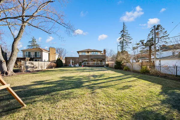 a swimming pool with outdoor seating and yard