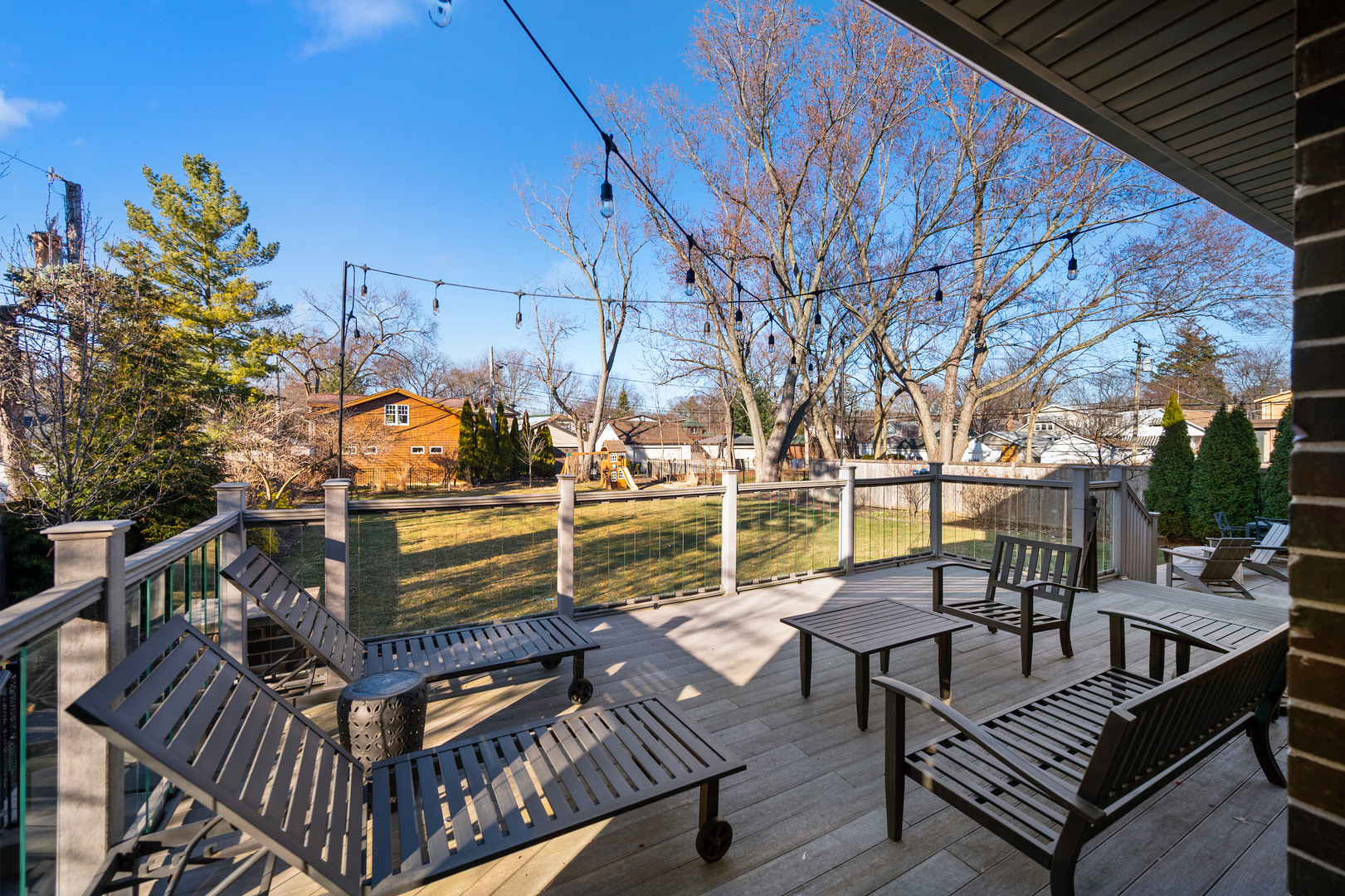 2921 Simpson Street Evanston, IL 60201 - Photo 23 of 27 a view of a roof deck with couches and wooden floor