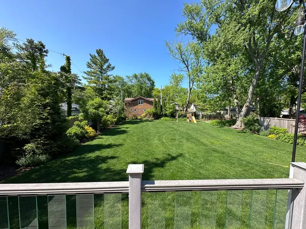 a view of outdoor space with deck and yard
