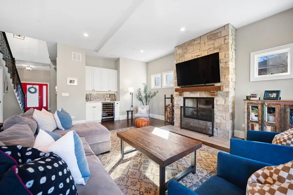 a living room with furniture fireplace and flat screen tv
