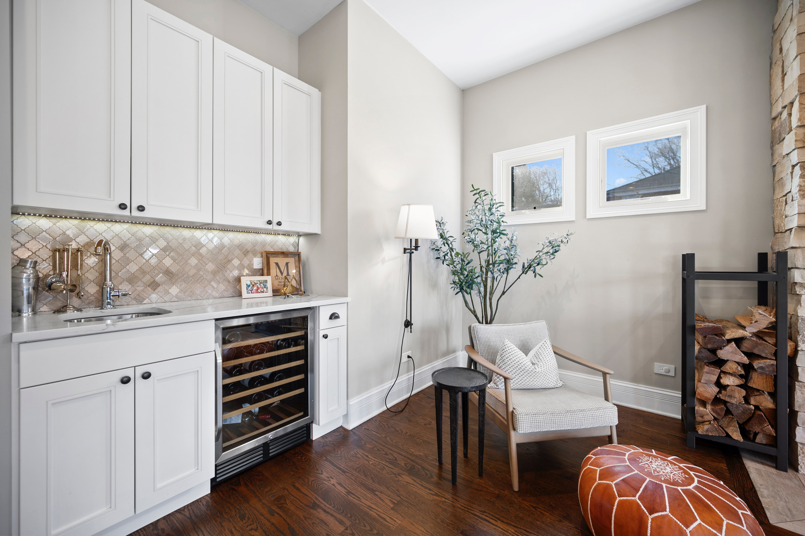 2921 Simpson Street Evanston, IL 60201 - Photo 7 of 27 a kitchen with stainless steel appliances white cabinets and wooden floor