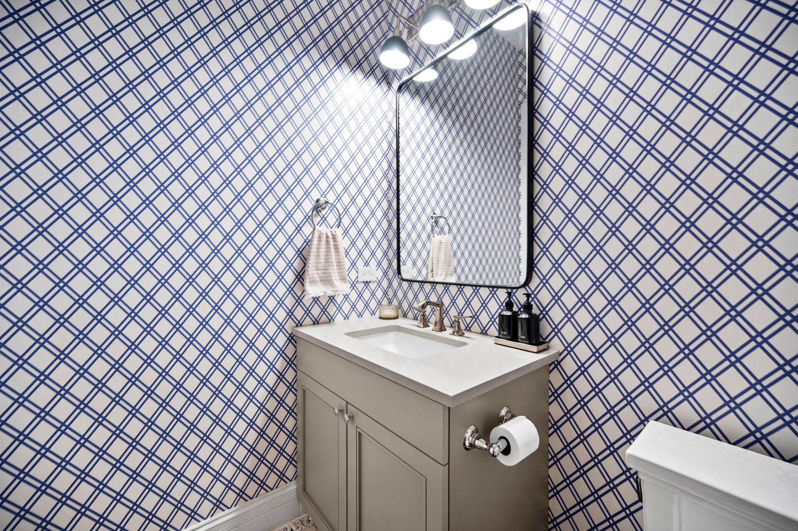 2921 Simpson Street Evanston, IL 60201 - Photo 9 of 27 a bathroom with a sink and a mirror