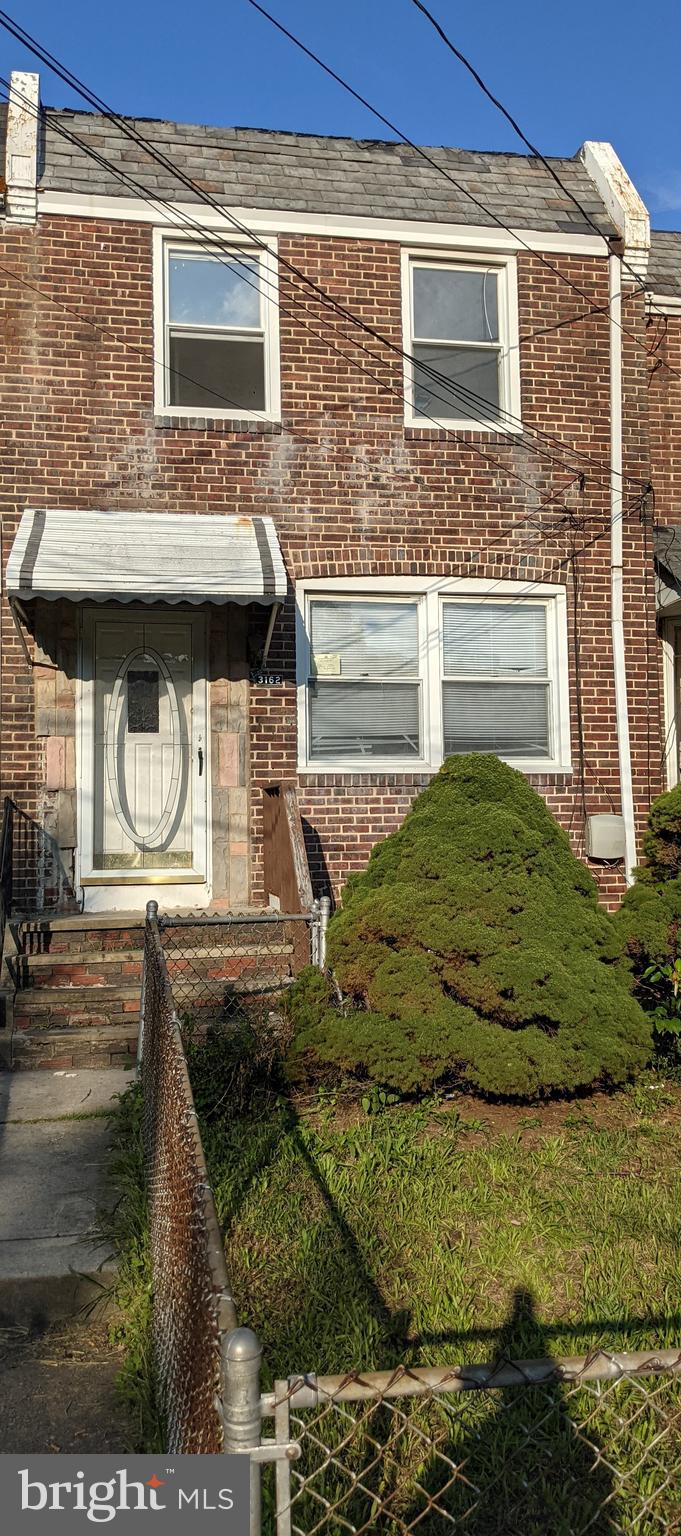 3162 Colorado Road Camden, NJ 08104 - Photo 1 of 21 a view of a brick house with a yard