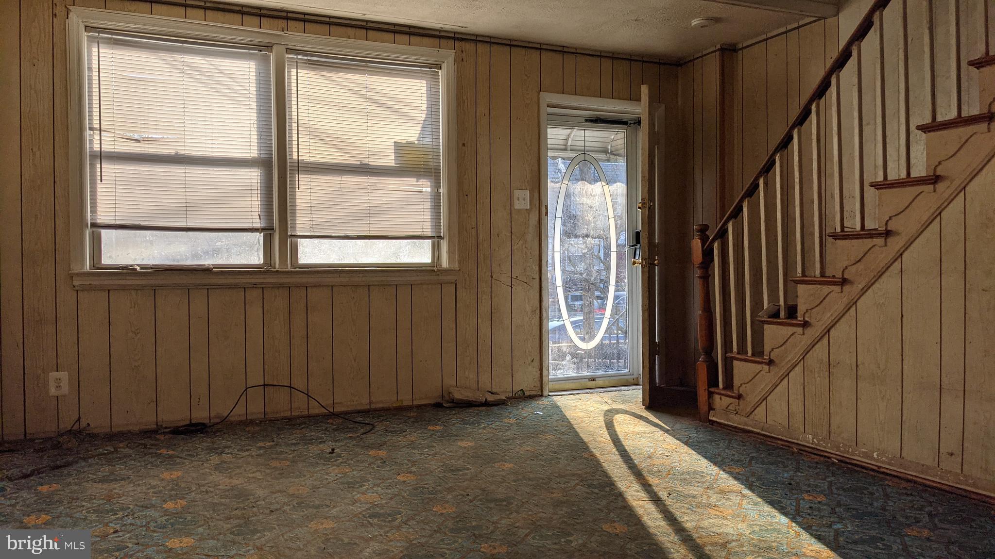 3162 Colorado Road Camden, NJ 08104 - Photo 2 of 21 an entryway with wooden floor and stairs