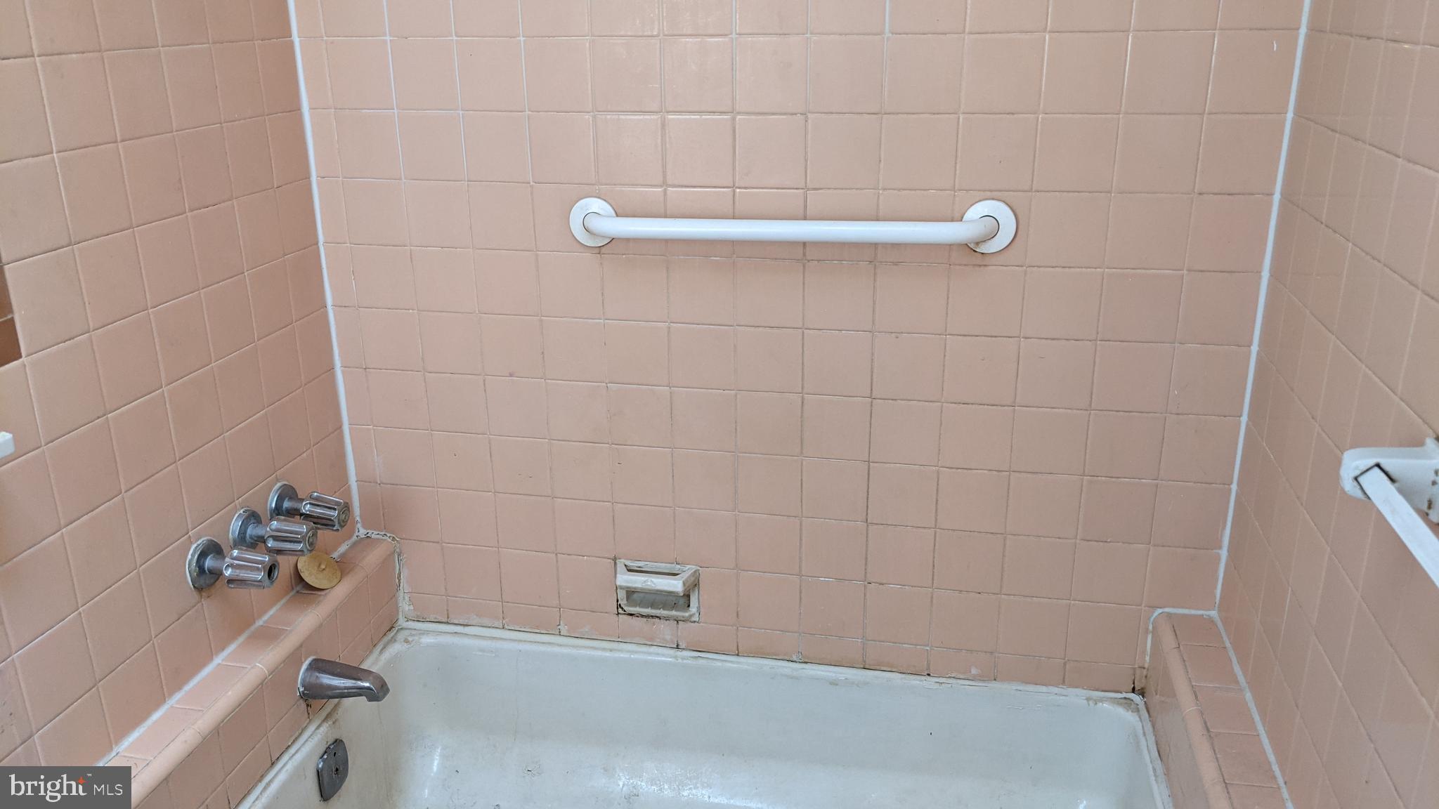 3162 Colorado Road Camden, NJ 08104 - Photo 12 of 21 a bathroom with a tub and a shower