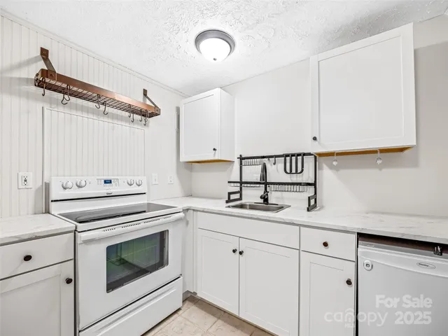 a kitchen with a stove and a refrigerator