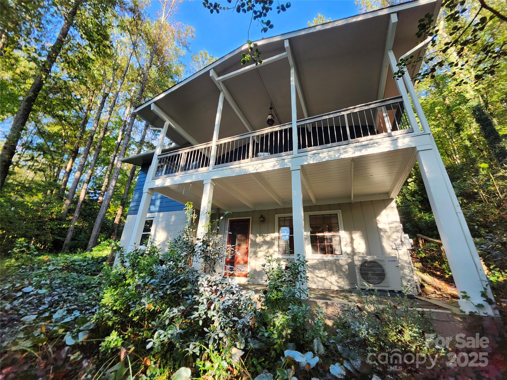 112 Top Of The Mountain Road Hendersonville, NC 28739 - Photo 21 of 28 a front view of a house with plants