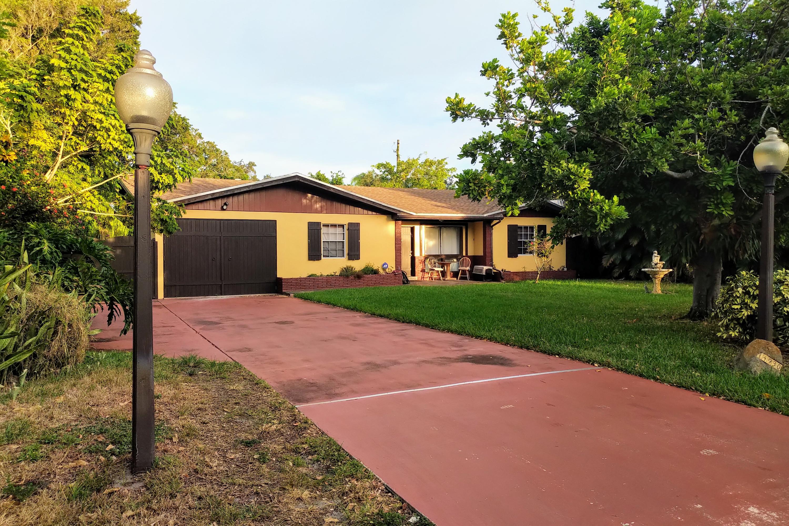 14930 Whatley Road Delray Beach, FL 33445 - Photo 26 of 26 a front view of a house with a yard and garage
