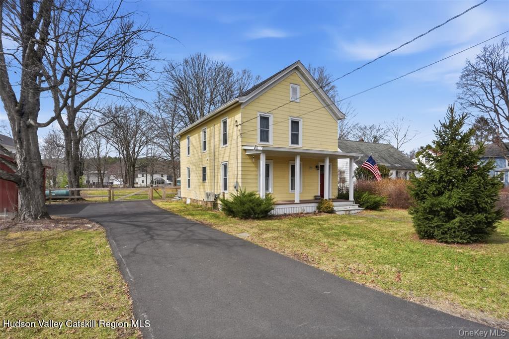 745 Springtown Road Tillson, NY 12486 - Photo 2 of 29 a view of a house with a yard and large tree