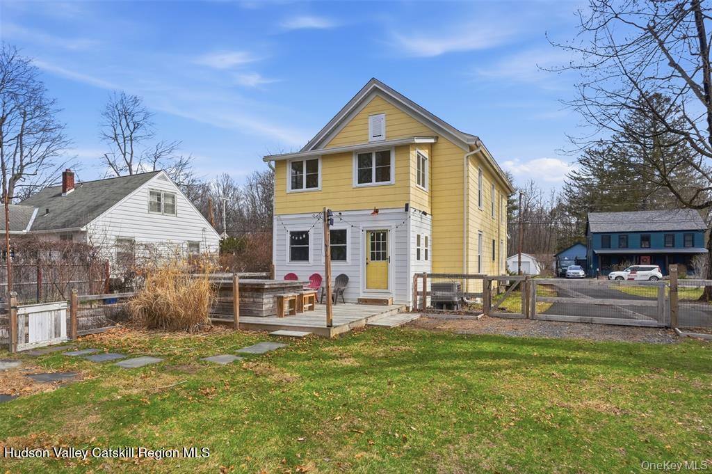 745 Springtown Road Tillson, NY 12486 - Photo 29 of 29 a view of a house with a yard patio and sitting area