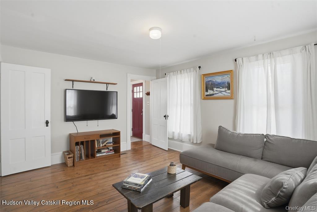745 Springtown Road Tillson, NY 12486 - Photo 5 of 29 a living room with furniture and a flat screen tv