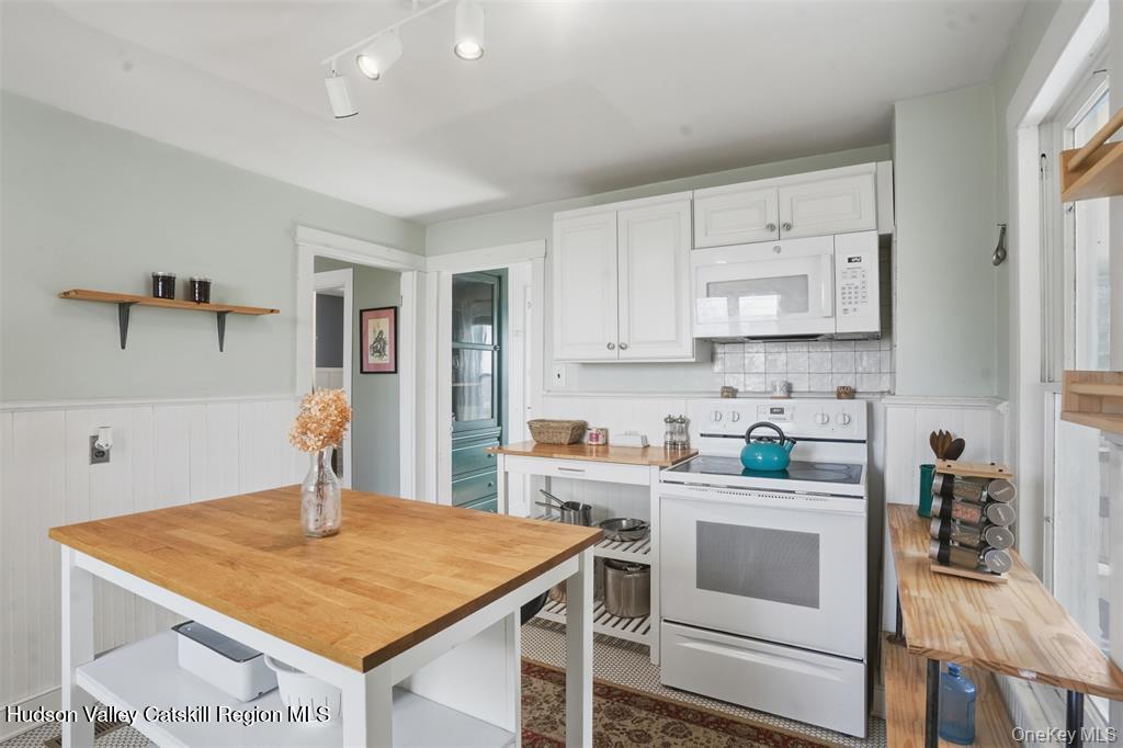 745 Springtown Road Tillson, NY 12486 - Photo 8 of 29 a kitchen with stainless steel appliances a stove a sink and a refrigerator