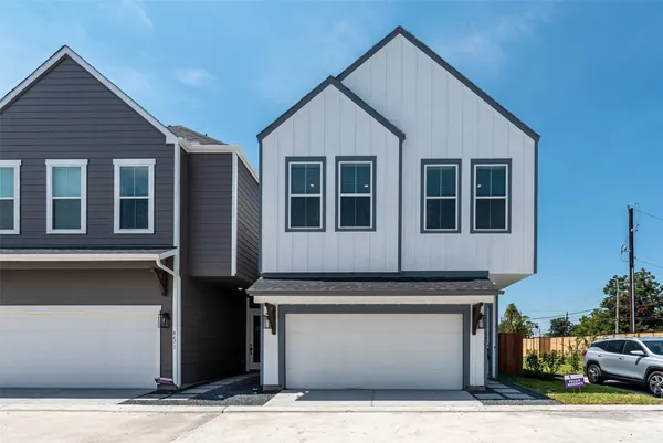 a front view of a house with a garage