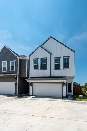 a front view of a house with garage