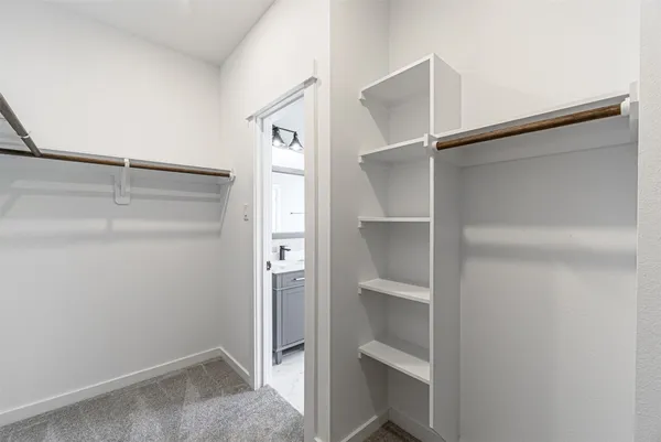 a view of an empty walk in closet