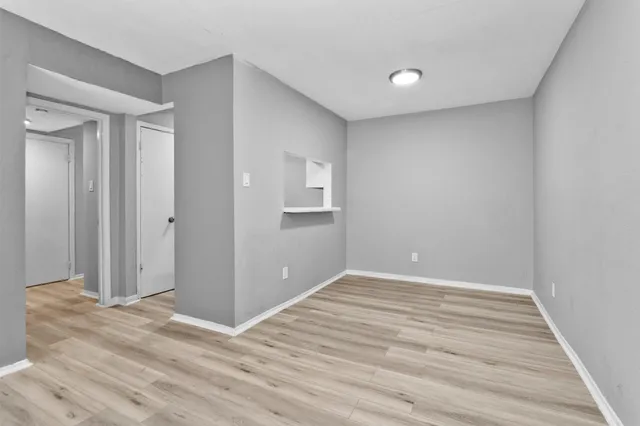 a white refrigerator freezer and a stove sitting inside of a kitchen