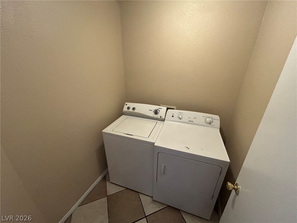 2806 Rungsted Street Las Vegas, NV 89142 - Photo 11 of 18 Functional laundry nook with dedicated appliances, perfect for daily chores.