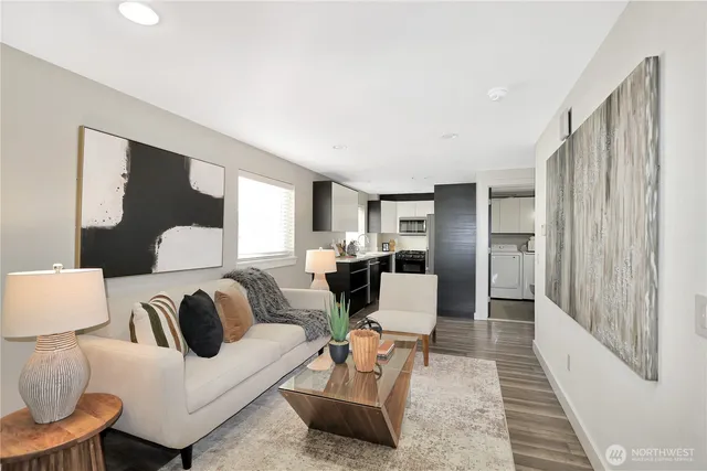 a living room with furniture and a rug