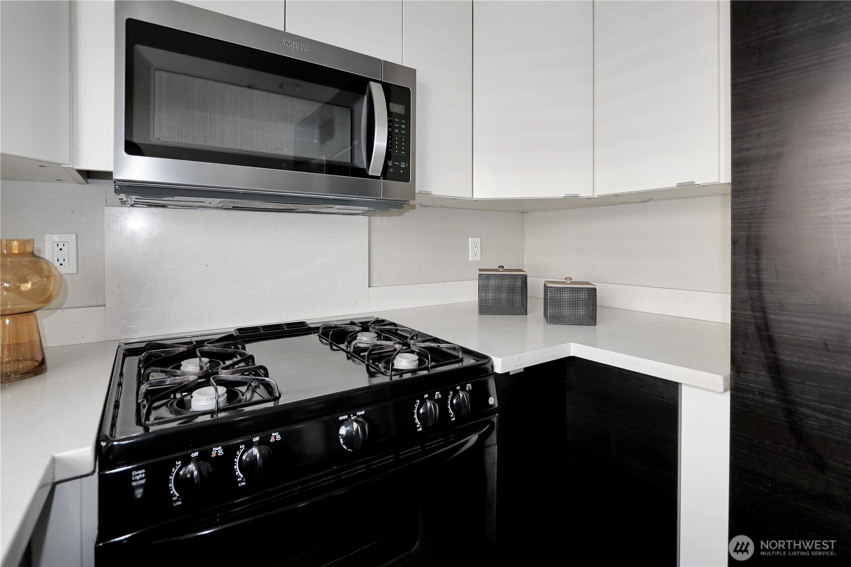1533 18th Avenue South, Unit 5 Seattle, WA 98144 - Photo 11 of 20 a kitchen with a stove and a microwave