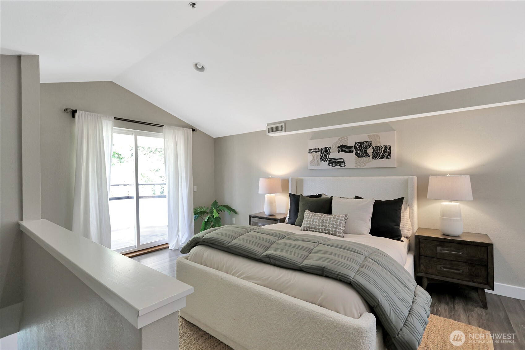 1533 18th Avenue South, Unit 5 Seattle, WA 98144 - Photo 15 of 20 a bedroom with a bed and a large window