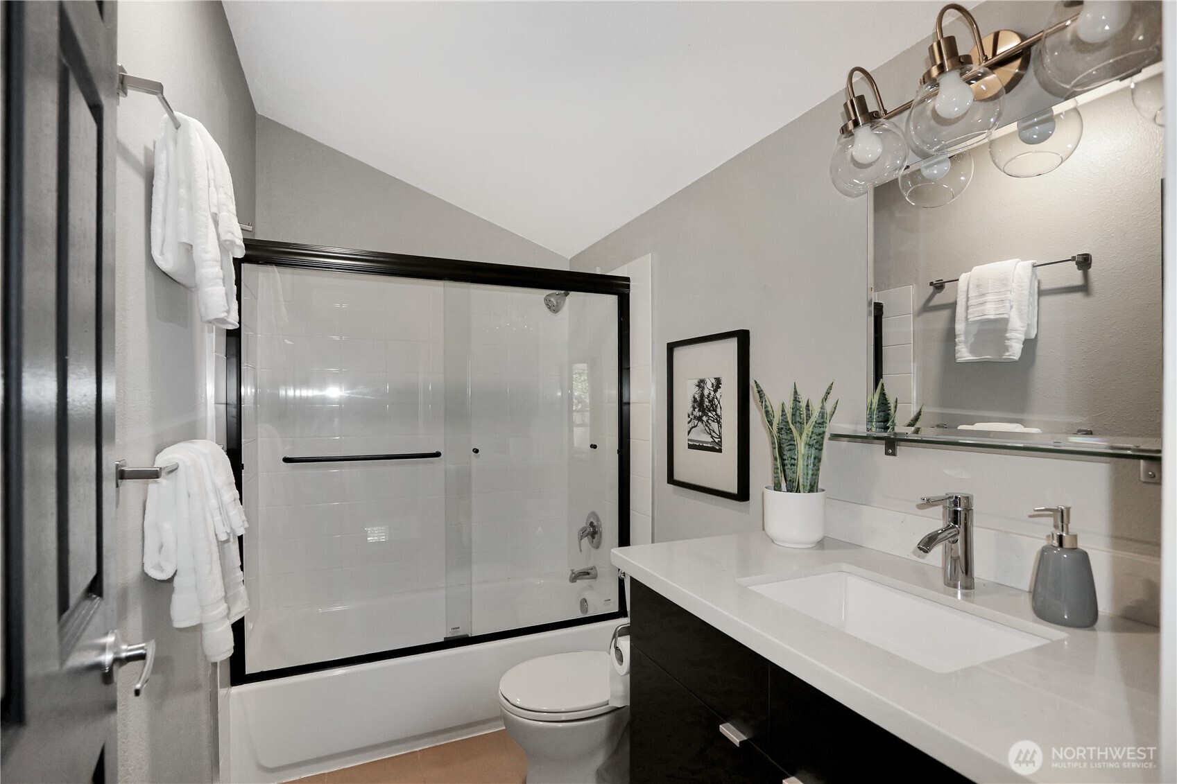 1533 18th Avenue South, Unit 5 Seattle, WA 98144 - Photo 16 of 20 a bathroom with a granite countertop sink toilet and shower