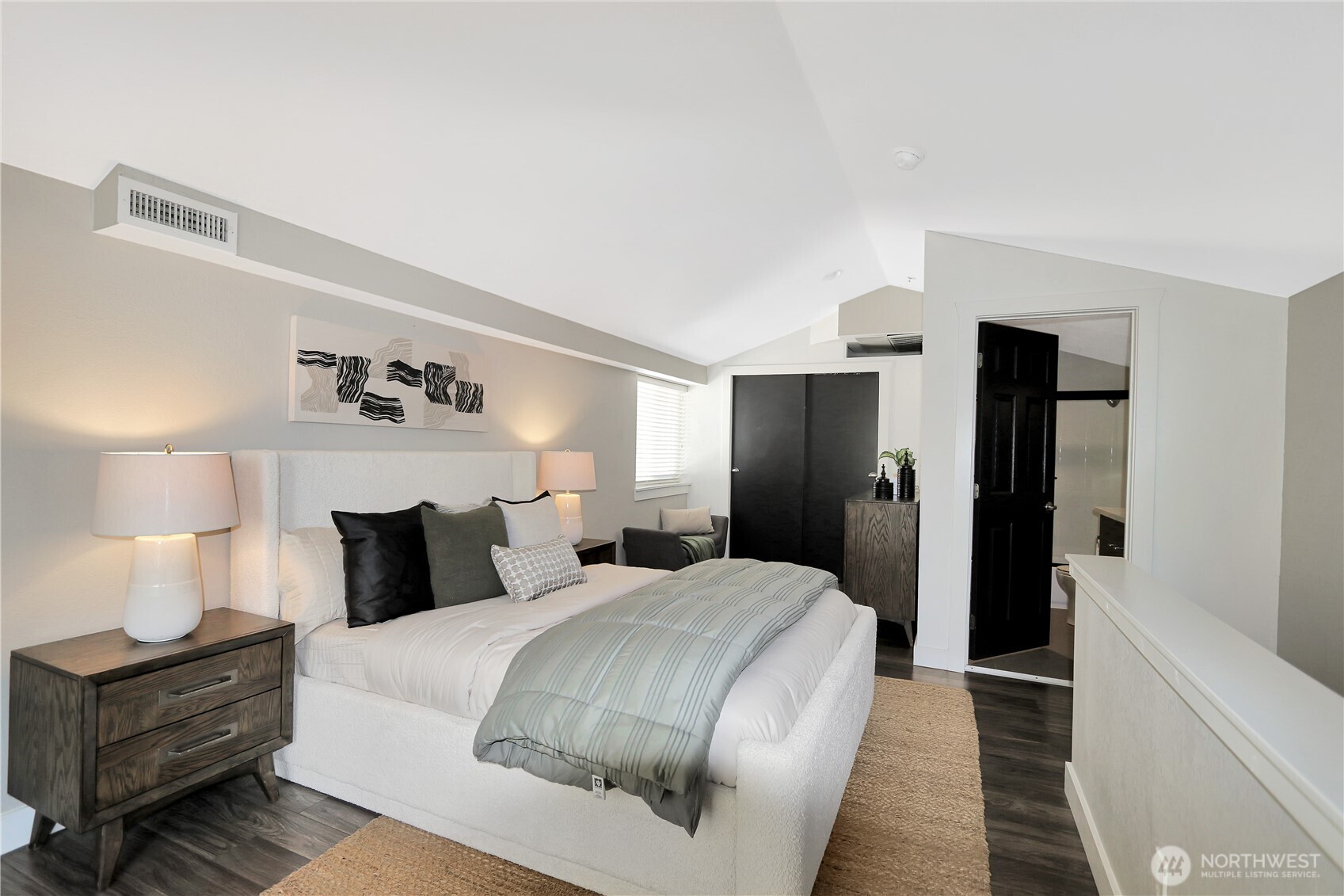 1533 18th Avenue South, Unit 5 Seattle, WA 98144 - Photo 18 of 20 a bedroom with a bed and a lamp