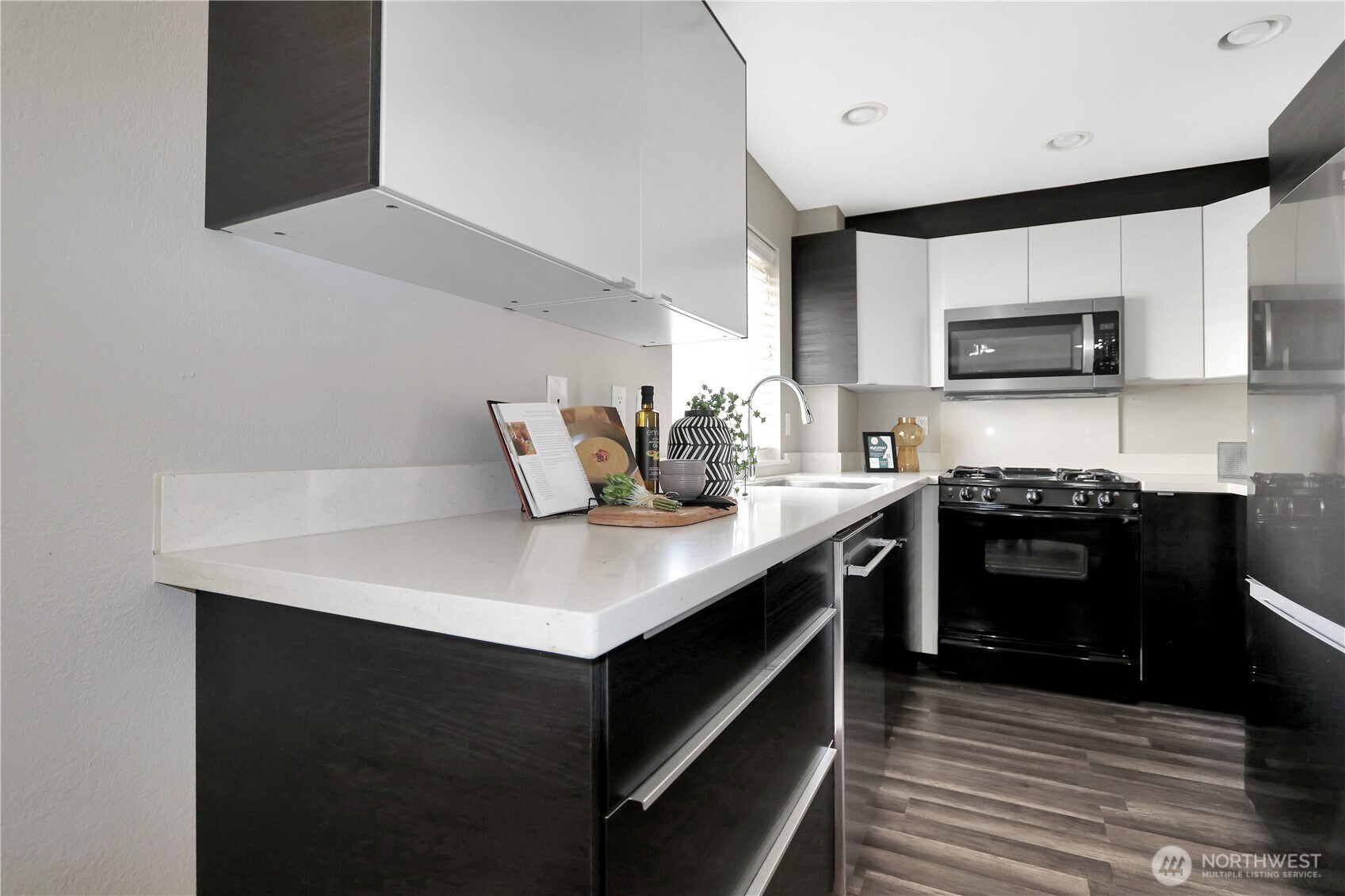 1533 18th Avenue South, Unit 5 Seattle, WA 98144 - Photo 9 of 20 a kitchen with stainless steel appliances a stove and a refrigerator