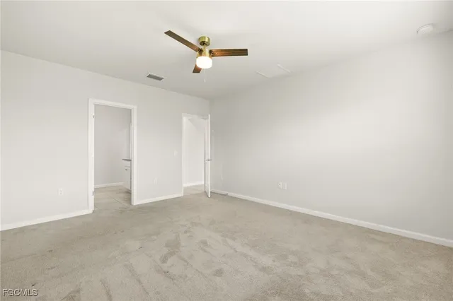 a bathroom with a shower and a sink