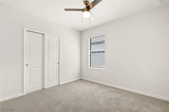 a bathroom with a granite countertop sink a toilet and bathtub