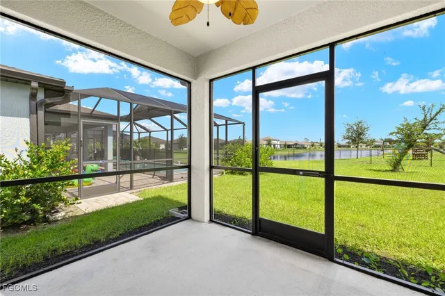 a group of people sitting in a big yard