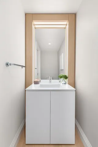 a kitchen with a sink and cabinets