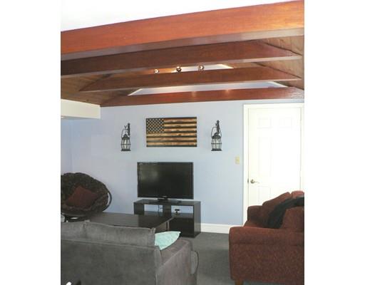1 East Colonial Road Wilbraham, MA 01095 - Photo 11 of 13 a living room with furniture and a flat screen tv