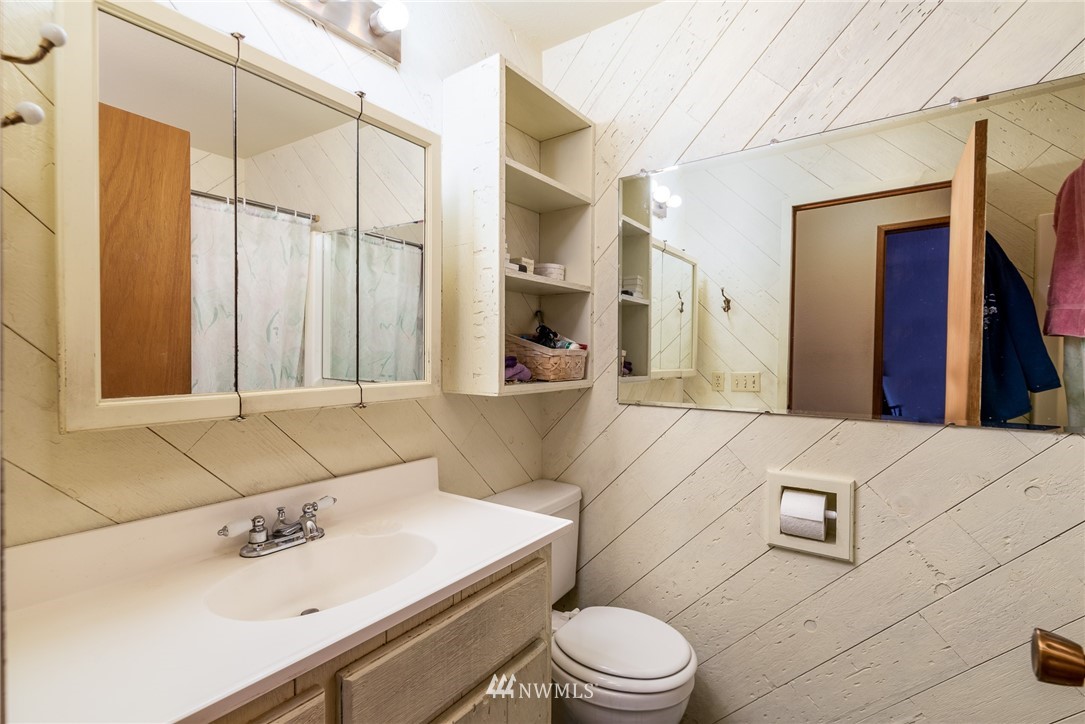 6130 North Fork Road Deming, WA 98244 - Photo 14 of 22 a bathroom with a sink a toilet and mirror