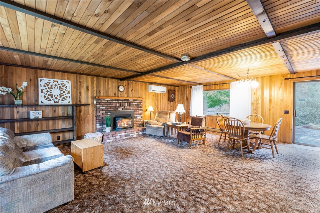 6130 North Fork Road Deming, WA 98244 - Photo 9 of 22 a living room with furniture and a fireplace