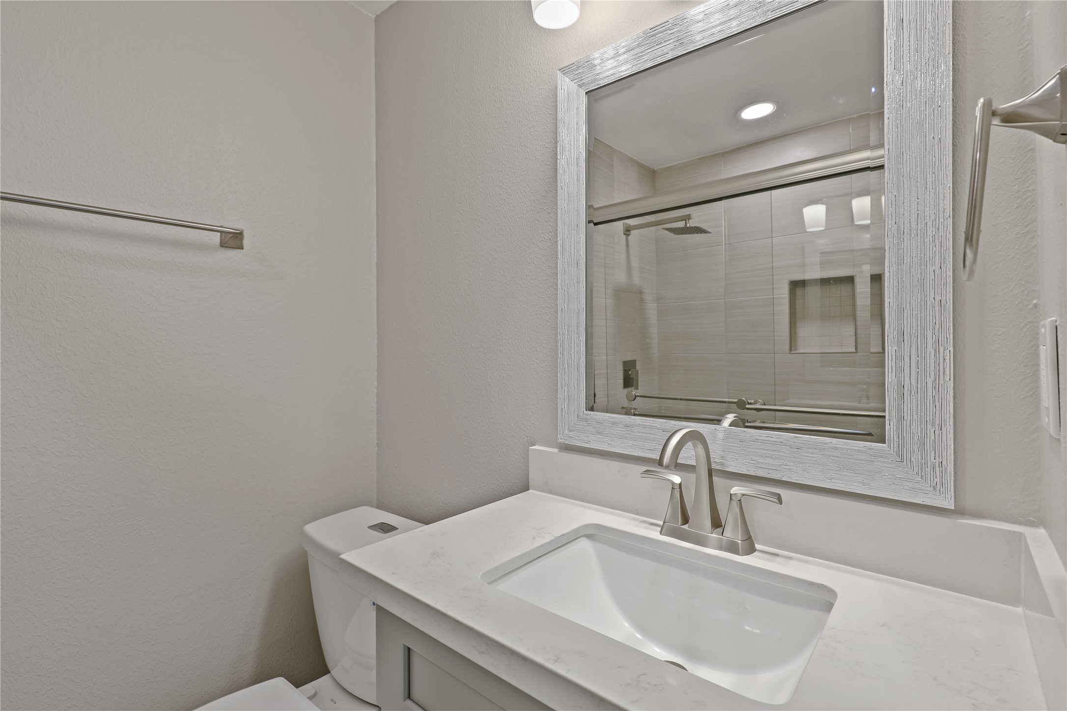 2201 Fountain View Drive, Unit 45 Houston, TX 77057 - Photo 10 of 11 a bathroom with a sink and a toilet