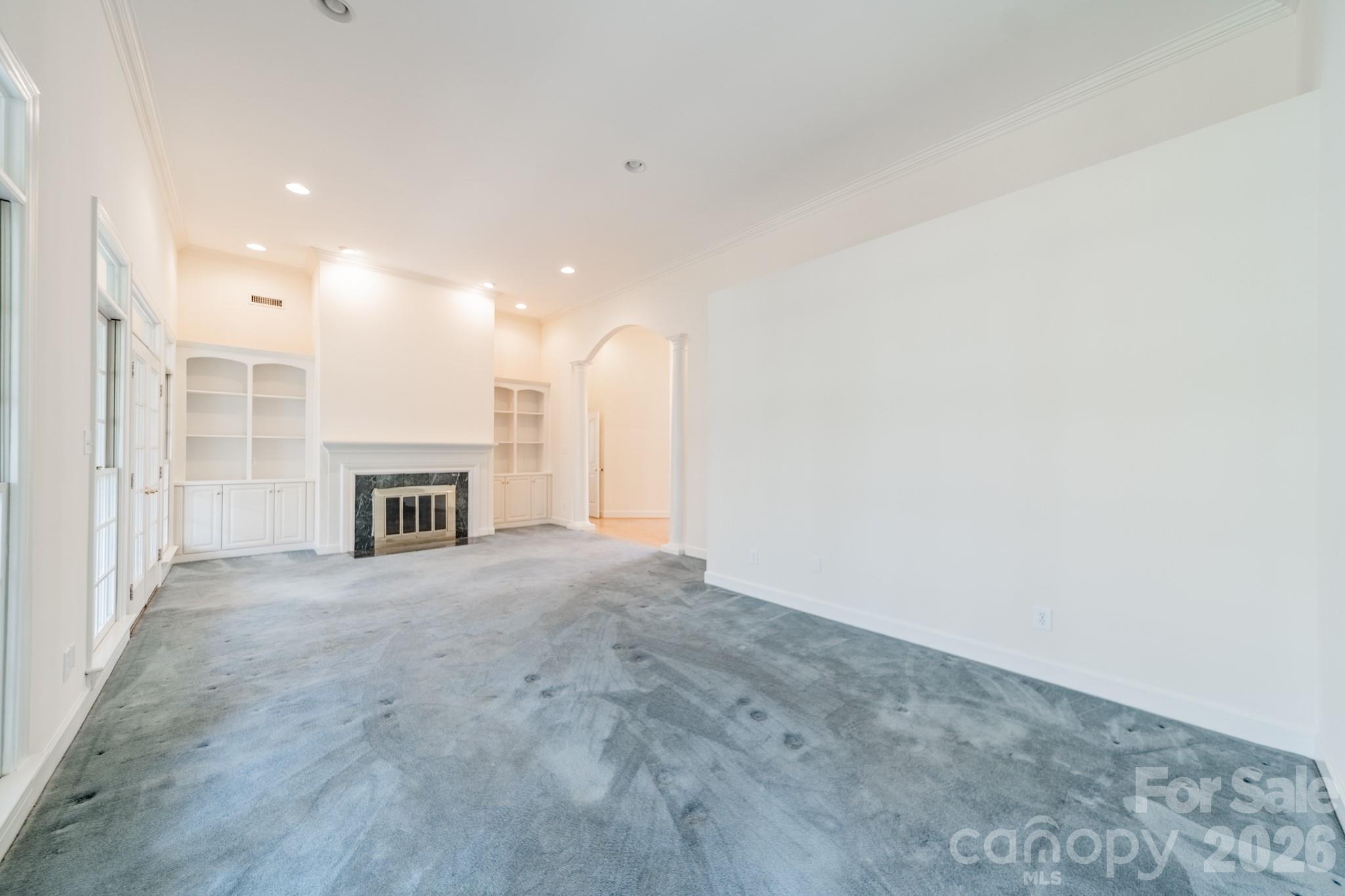 316 Kimberly Road Davidson, NC 28036 - Photo 15 of 37 a view of an empty room with a fireplace