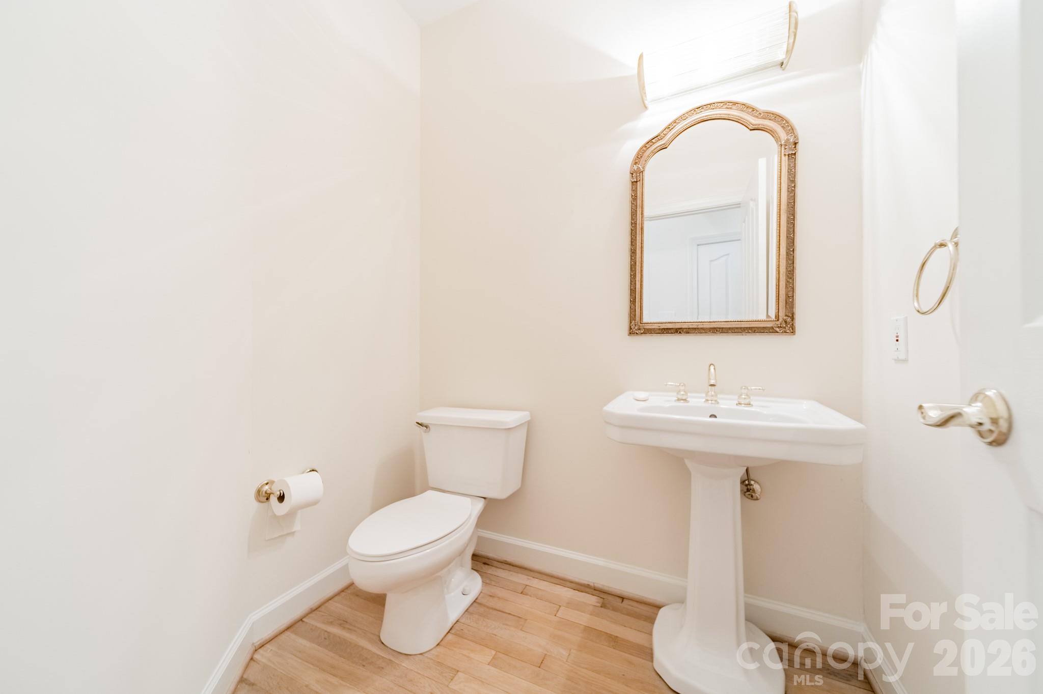 316 Kimberly Road Davidson, NC 28036 - Photo 16 of 37 a bathroom with a toilet sink and mirror