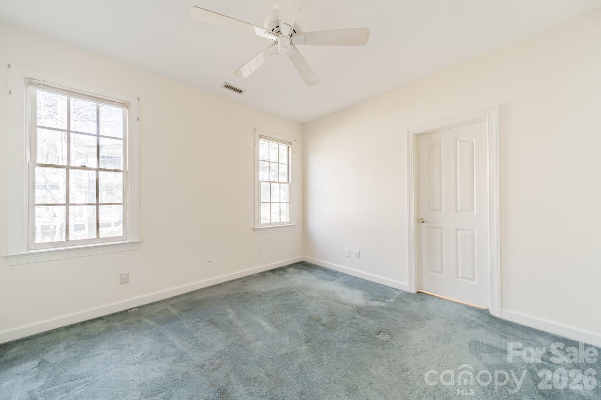 316 Kimberly Road Davidson, NC 28036 - Photo 19 of 37 an empty room with windows and closet